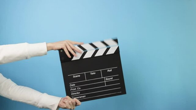 Video production process, cameraman and director using a slate for a new movie clip