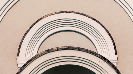 facade of a vintage building with curved lines