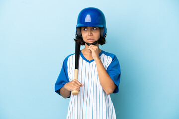 Baseball mixed race player woman with helmet and bat isolated on blue background having doubts and thinking