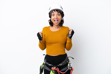 Young woman rock-climber woman isolated on white background celebrating a victory in winner position