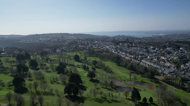 Torquay, Torbay, South Devon, England: DRONE VIEWS: Torquay golf club and its eighteen hole course. Torbay is a popular UK holiday destination with many visitor attractions (Clip 3 of 4).