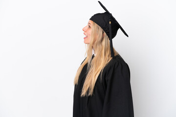 Young university graduate caucasian woman isolated on white background laughing in lateral position