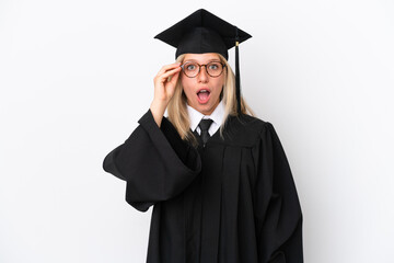 Young university graduate caucasian woman isolated on white background with glasses and surprised