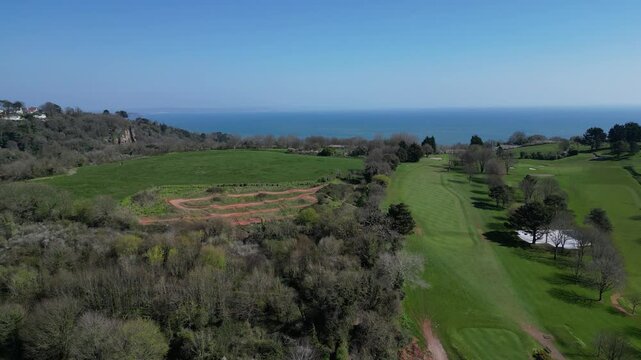 Torquay, Torbay, South Devon, England: DRONE VIEWS: Torquay golf club and its eighteen hole course. Torbay is a popular UK holiday destination with many visitor attractions (Clip 1 of 4).