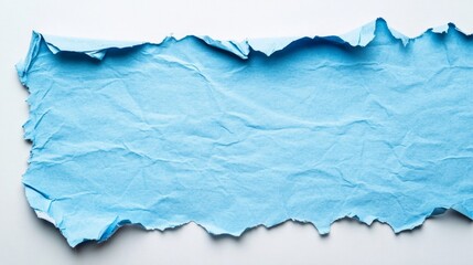 Fototapeta premium Torn blue paper sheet with wrinkled texture on white background surface.
