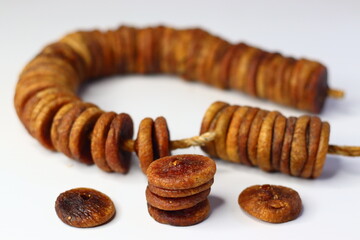 Dried figs on a string, showing rich texture and sweetness