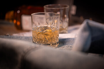 Close-up of whiskey in a crystal glass set against a dark, moody background—evoking elegance, sophistication, and premium lifestyle. Perfect for alcohol brands, bar ads, and luxury lifestyle content.