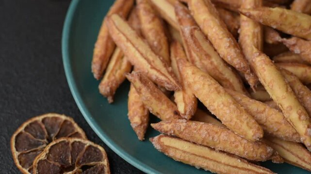 Cinnamon flavored biscuits or breadsticks as a food background.