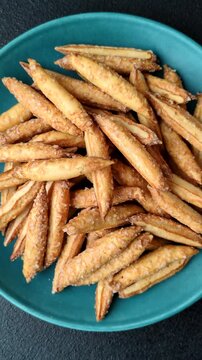 Cinnamon flavored biscuits or breadsticks as a food background.