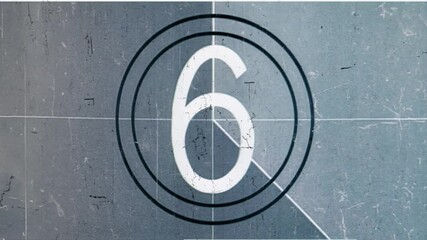 Vintage film countdown leader with number 8-2, aged textures, defocused film look, flicker, grain and scratches effect, classic reel markings for retro video overlays, 4K