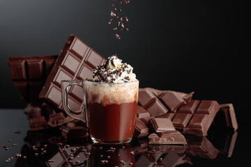 Hot chocolate with whipped cream and sprinkled with chocolate crumb.