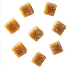 Delicious Golden Sugar Cubes Floating in Bright White Background with Sparkling Texture
