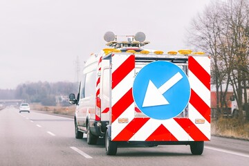 Road maintenance vehicle on highway