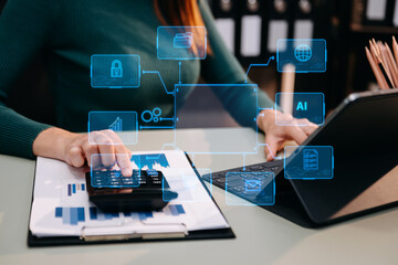 Woman accountant use Laptop and calculator to calculate the company's financial with icon banking...