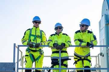 Confident engineers celebrating on platform