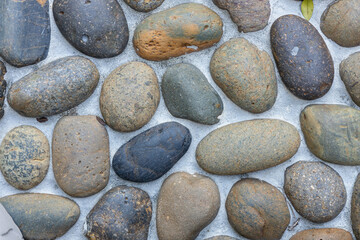 Close-up of a pebble-patterned walkway surface.