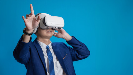 Businessman in VR headset controls virtual reality AI program to give instructions