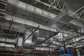 Naklejka premium Industrial HVAC duct system in large building