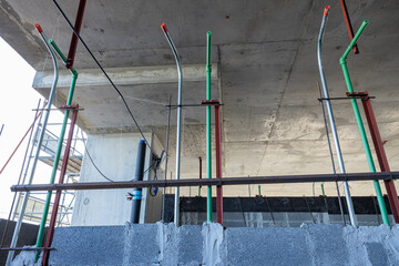 Plumbing works laying CW pipes in brick walls to prepare for plastering