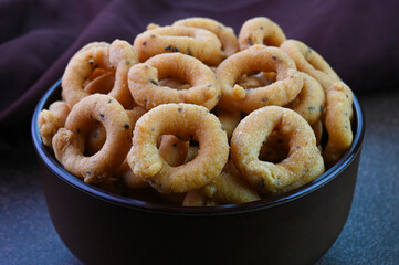 Andhra Murukku indian snack dish in a bowl.