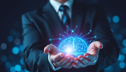 Businessman Holding Glowing Blue Brain Hologram Representing Artificial Intelligence and Innovation

