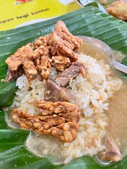 Nasi Gandul is a traditional Indonesian food with rice, meat and tempeh.
