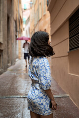 Beautiful young mixed race woman in the old town of Nice, France