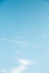 Beautiful light blue sky with fluffy clouds