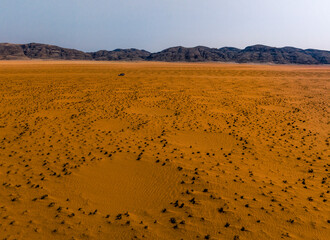 Vast orange African Landscape with Fairy Circles, Kaokoveld, Namibia