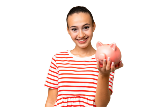 Young Arab woman holding a piggybank over isolated background with happy expression