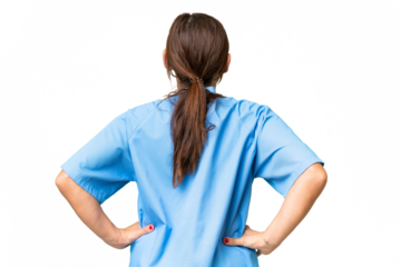 Middle-aged nurse woman over isolated background in back position