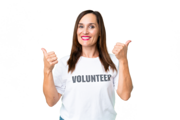 Middle age volunteer woman over isolated chroma key background with thumbs up gesture and smiling
