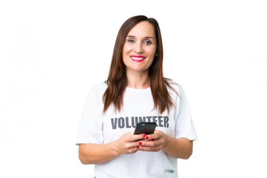 Middle age volunteer woman over isolated chroma key background sending a message with the mobile