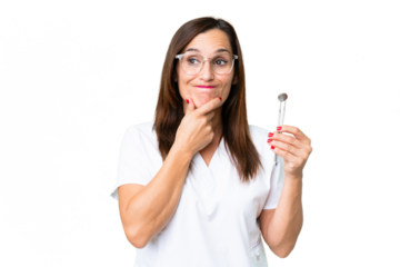 Dentist caucasian woman over isolated chroma key background having doubts and thinking