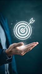 Businessman holding a glowing target icon with an arrow, symbolizing business success, goal achievement and futuristic innovation for strategic planning