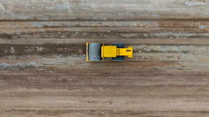 Top view soil compactor road roller leveling ground for foundation road construction, Soil...