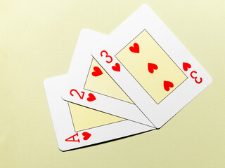 Heart cards from the deck on a green mat