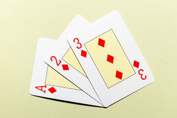diamond cards from the deck on a green mat