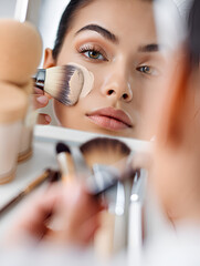 woman applying mascara