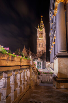 The illuminated St Baaf's Cathedral at night, from the steps of the town hall of the Flemish city of Ghent