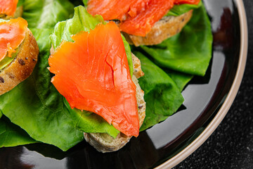 Salmon sandwich red fish seafood appetizer dish fresh tasty gourmet food background on table rustic food top view copy space 