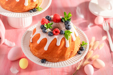 Homemade ring cake for Easter with festive spirit decor.