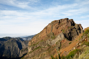 Mountain peaks along the Pico do Arieiro to Pico Ruivo trail in Madeira, with clear skies highlighting the rugged terrain.