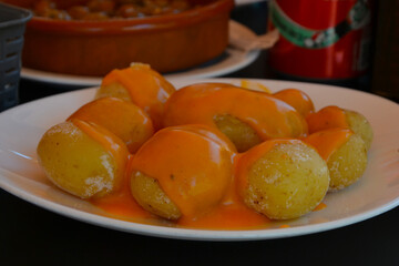 Wrinkled potatoes (spanish: papas arrugadas). Potatoes with mojo picon, typical dish of Canarian food, Gran Canaria, Spain