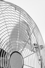 outdoor electric fan with metal safety net, photo on white background