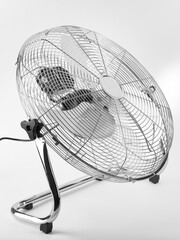 outdoor electric fan with metal safety net, photo on white background