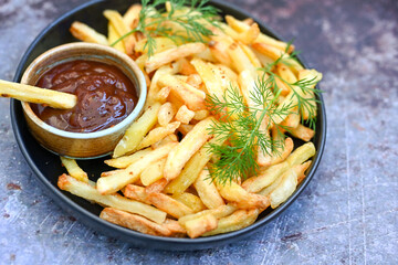  Home made   Fresh fried French fries  in a bowl on wooden rustic  background