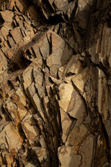 A detailed view of the rugged rock formations on Madeira, with textures that showcase the natural erosion, sharp edges, and earthy tones.