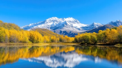 Obraz premium Autumnal alpine lake reflecting majestic snow-capped peaks