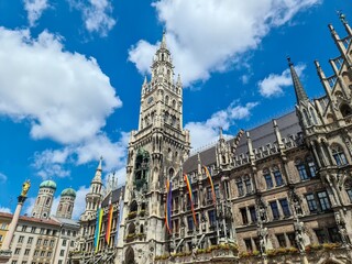 Fototapeta premium Neues Rathaus displaying rainbow flags in Munich, Germany